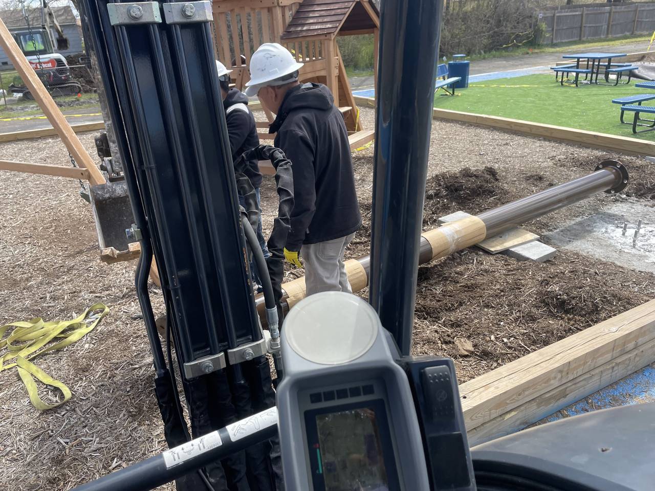 Commercial foundation team evaluating a grade beam and underpinning work area